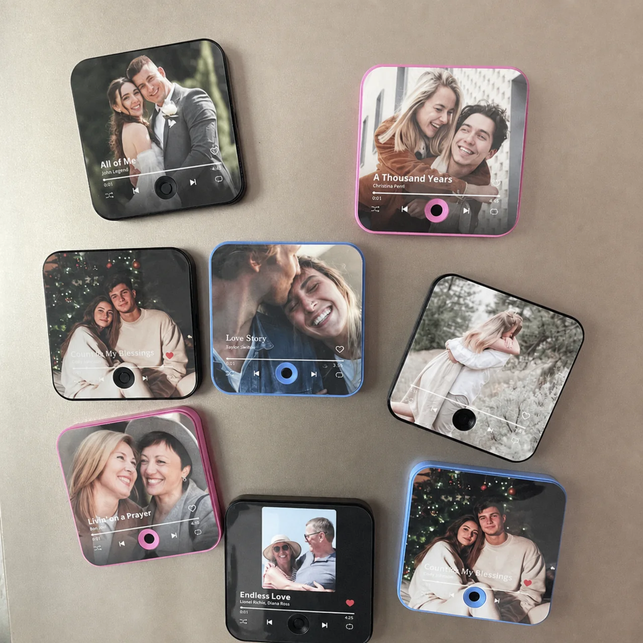 Several personal music boxes with photos and playback controls