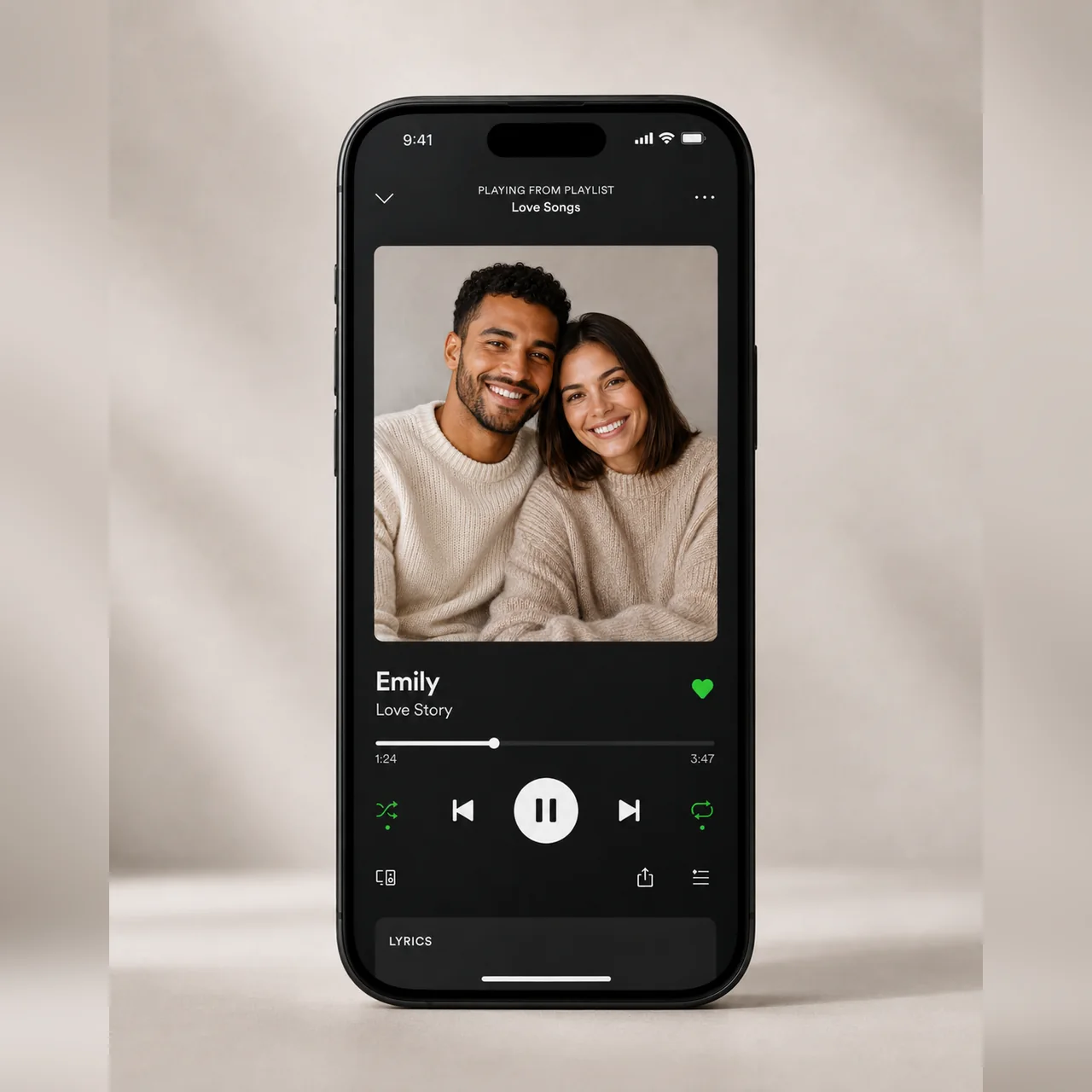 Phone showing a personal song and a photo of a couple