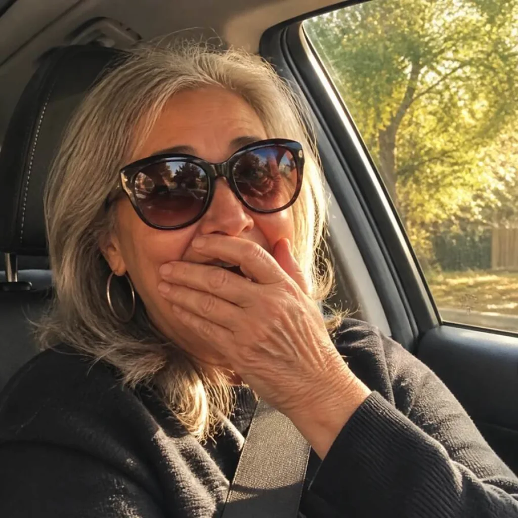 Older woman reacting with surprise inside a car