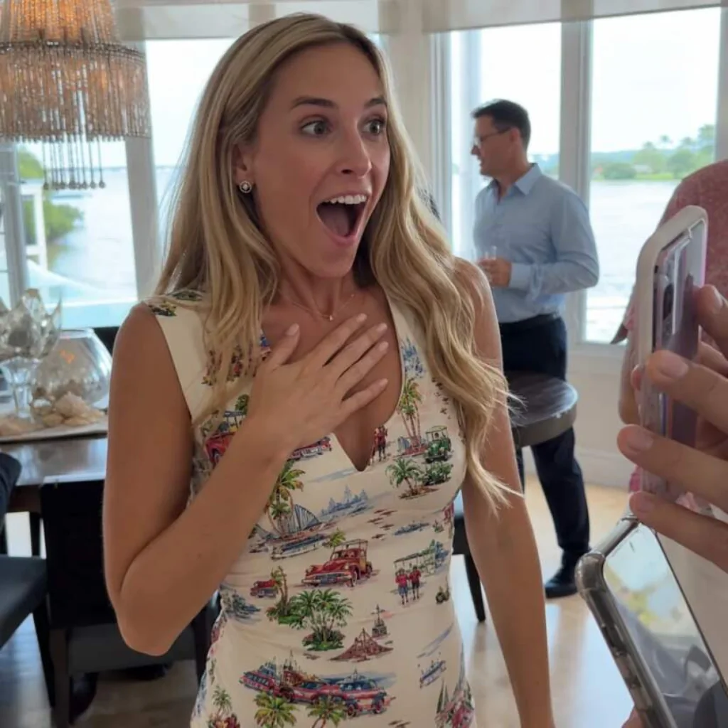 Blonde woman reacting with surprise at a gathering