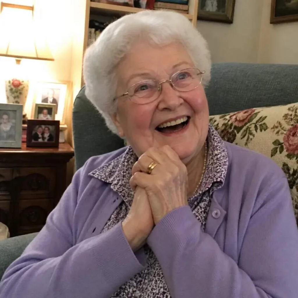 Grandmother laughing in her armchair