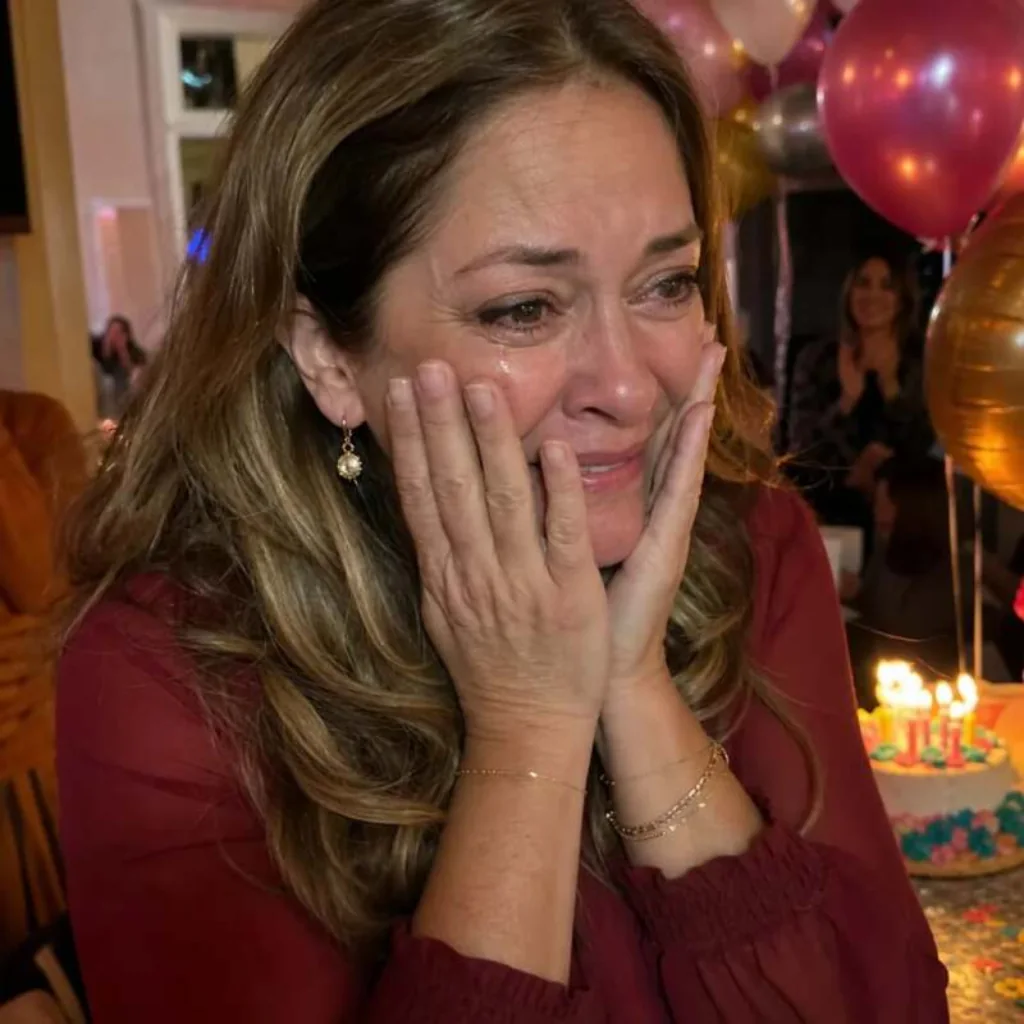Woman crying happy tears at a birthday party