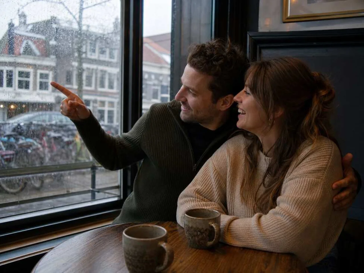 A couple revisiting memories in a familiar café for their personalized wedding song